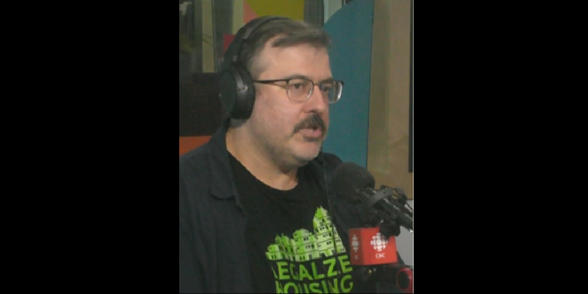 A picture of Peter Waldkirch being interviewed in the CBC radio room.